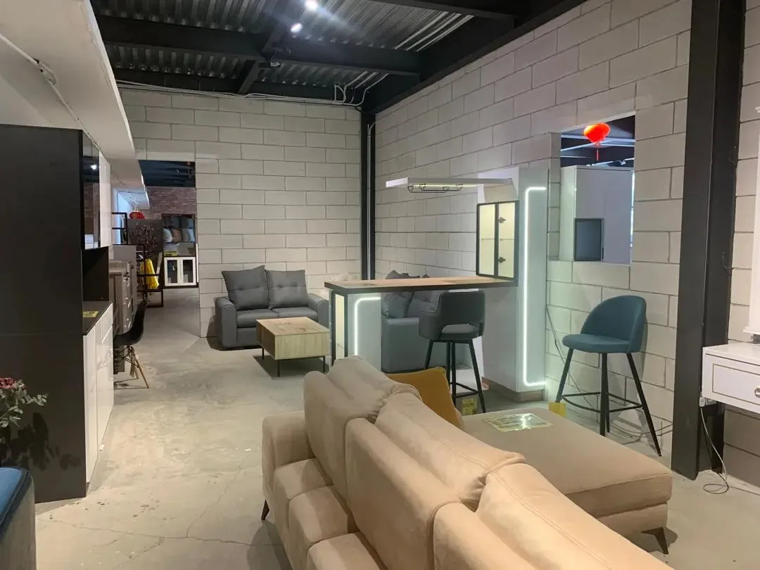 Modern interior design with a sofa, coffee table, and chairs in a stylish room.